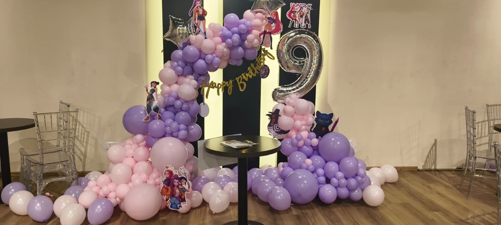 A purple themed birthday decoration
