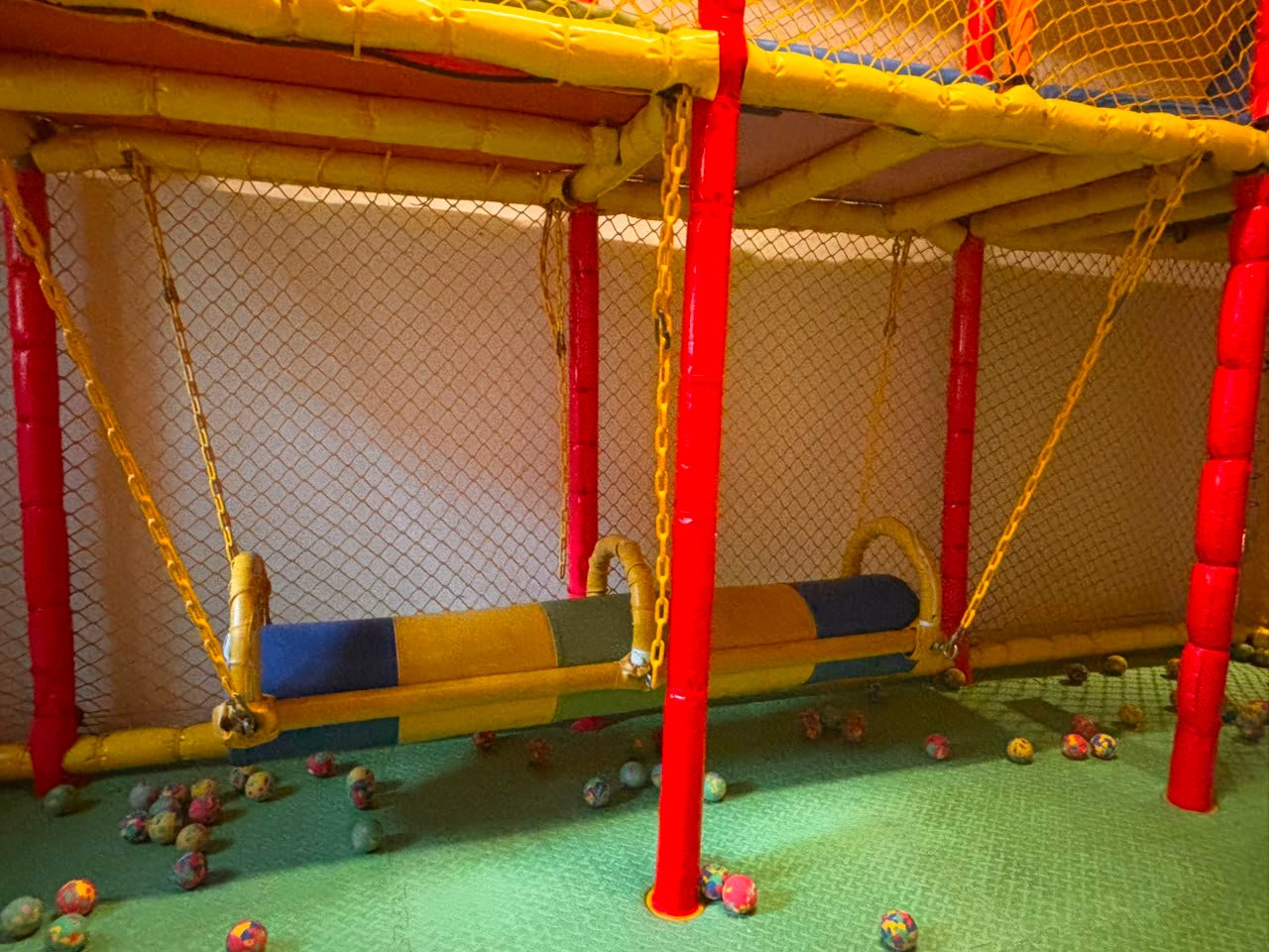 A colourful soft play obstacle area